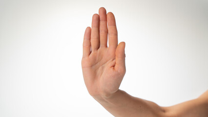 woman's hand gesture stop on a white background