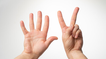 Men's hands gesture counting on fingers seven palmar side