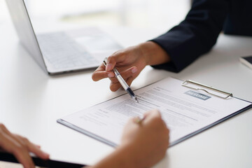 New graduate woman filling out an application form for HR department Review and review your educational background and interview details.