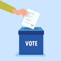 Hand puts vote bulletin into vote box