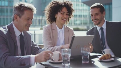 Cinematic footage of business colleagues talking about sales strategy during the coffee break in a cafe. Concept about businesspeople and finance - Powered by Adobe