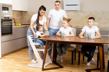 Happy family having breakfast together in kitchen