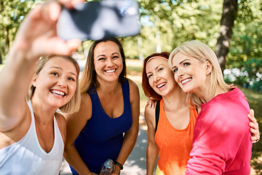 Group Of Women Taking Selfie After Outdoor Exercising In Park