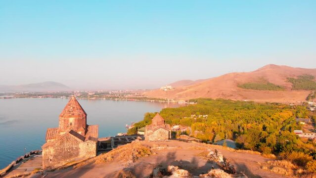 Sevanavank armenian monastery complex in Sevan city with blue lake panorama at sunrise . Famous landmark sightseeing in caucasus. Armenia travel concept