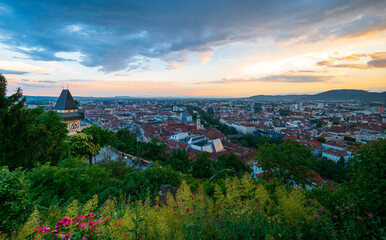 City of Graz, Austria and famous Uhrturm at sunset