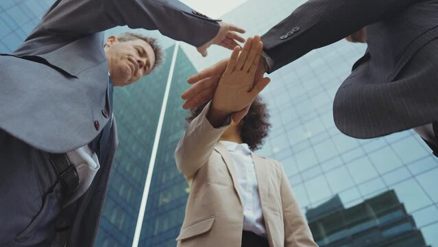 Cinematic footage of business colleagues talking about sales strategy during the break, celebrating the new deal. Concept about businesspeople and finance