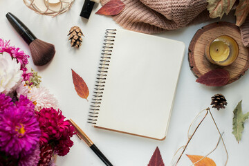weekly planner with asters and candle. autumn leaves and flowers