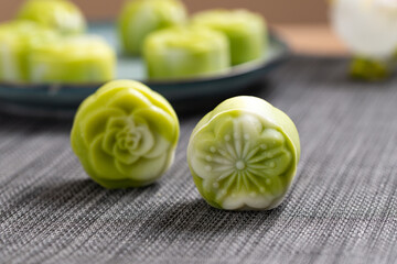 Traditional Chinese mid autumn festival dessert snowy skin mooncakes. The flavor is matcha green...