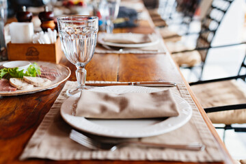 setting of a wooden table on the veranda.