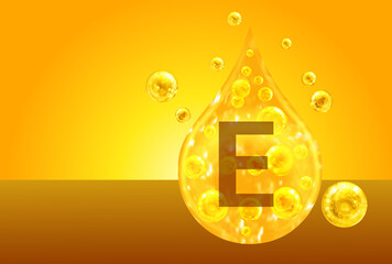 Vitamin E. Golden drops with oxygen bubbles. Health concept
