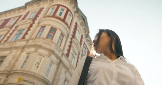 Asian girl walking on street and looking back sun flayers.
Successful young beautiful asian woman. Attractive business girl.