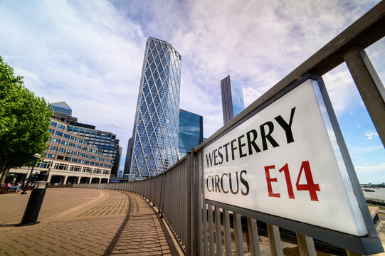 Sign for Westferry Circus E14, Canary Wharf with skyscrapers in the background