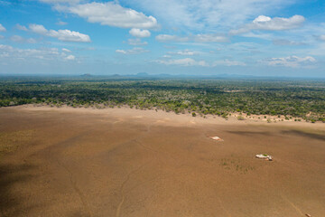 Fototapeta na wymiar A dry lake and swamps among the jungle. Kumana National Park.
