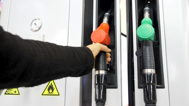 Gas station. Media.Cylinders with gasoline and gas are taken and then put in place for refueling the car.