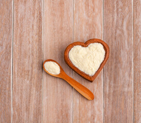 Powdered or dehydrated milk in the heart-shaped bowl