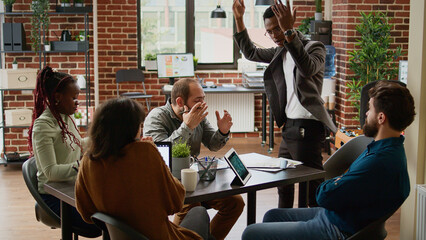 Angry frustrated boss throwing papers after team failure, having breakdown and shouting at...