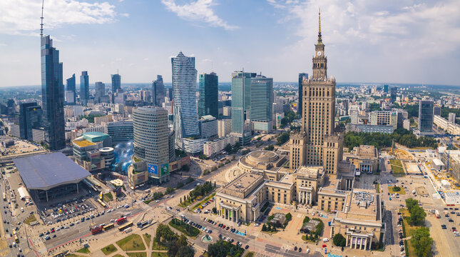 7.22.2022 Warsaw, Poland. Drone flight perspective concept. Sunny weather in downtown Warsaw. Famous skyscrapers from bird's eye perspective. High quality photo