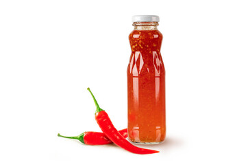 Red hot chili pepper in glass jar white chili isolated on white background.