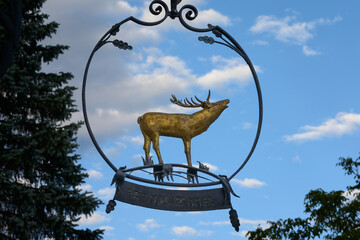 Golden deer roaring, historic restaurant sign, europe