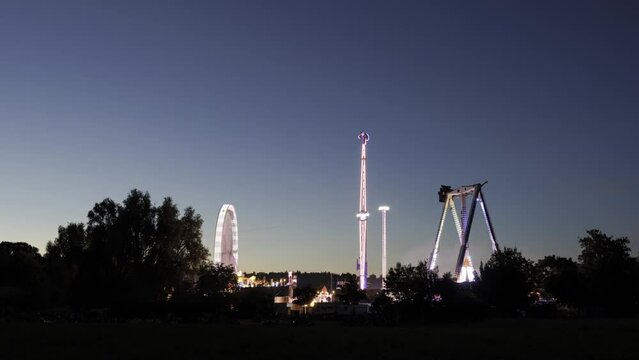Fair at dusk with people passing time lapse