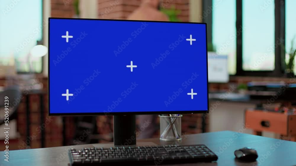 Poster nobody at desk with greenscreen template on computer monitor in business company office. desktop wit