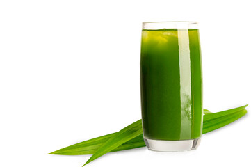 Glass of  pandan juice with pandan leaves on white background.