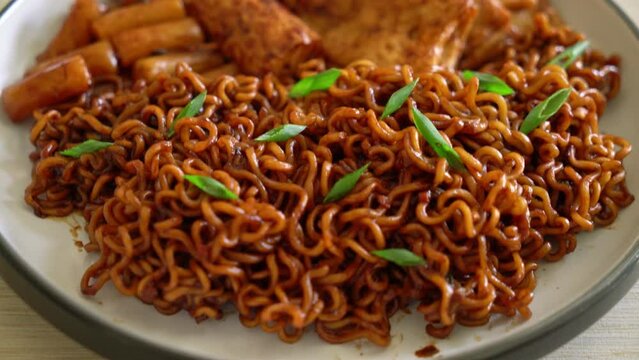 Jajangmyeon or JJajangmyeon with Odeng and Omuk - Korean Instant noodles with Korean fish cake in black bean sauce - Korean food style