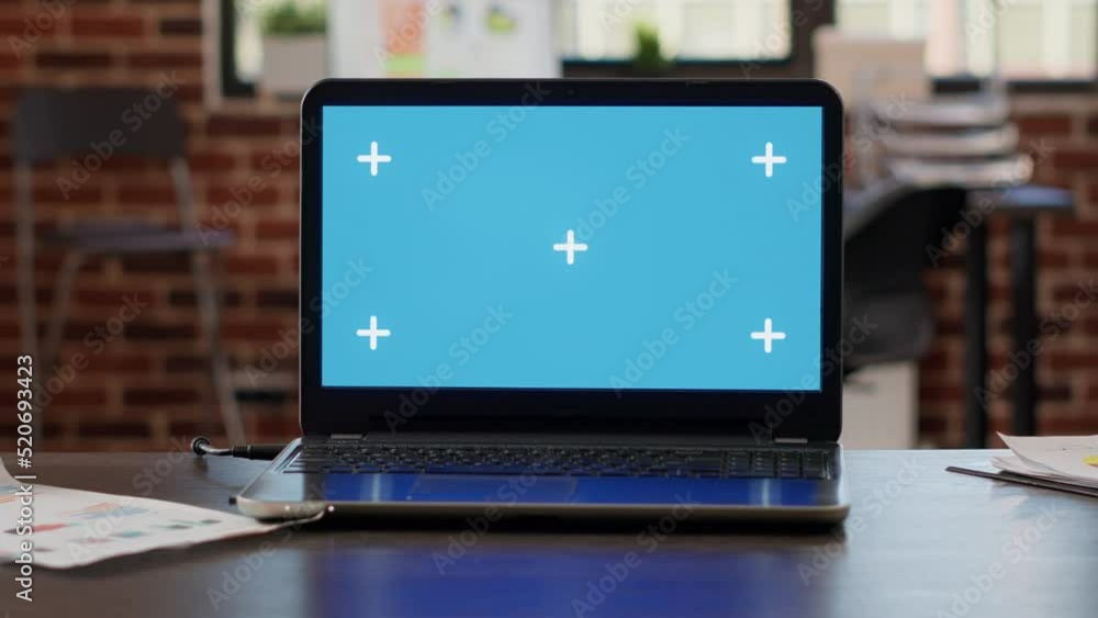 Poster laptop with greenscreen background in startup business workplace, empty desk with isolated chroma ke