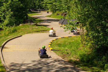 People in helmets enjoying karting