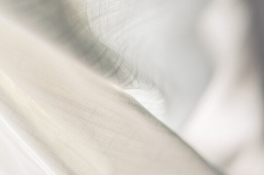 Linen blows in the Breeze - Abstract Image of White Cloth in Soft Sunlight
