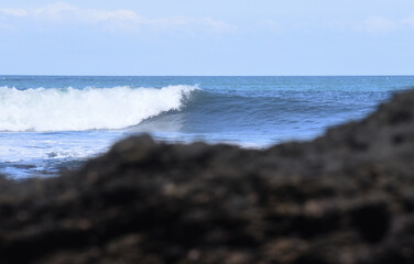 Seascapes at south cost in Bali island of Indonesia,with rock formation and big wave