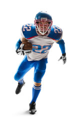 Sportsman in action. American football. Young agile american football player running fast towards...