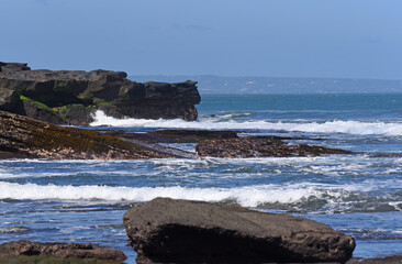 Seascapes at south cost in Bali island of Indonesia,with rock formation and big wave