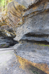 Rock formation at the south area of Bali island,with black sand beach