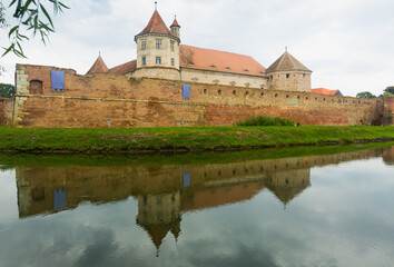 Castle on the lake is landmark of Fagaras in Romania.