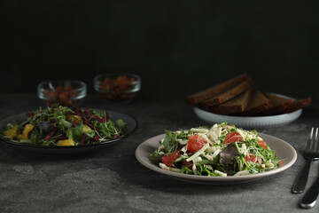 Delicious carrot salad served on grey table