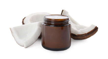 Jar of hand cream and coconut pieces on white background
