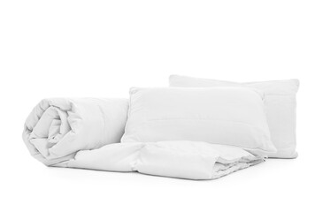 Fototapeta na wymiar Soft blanket with pillows on white background