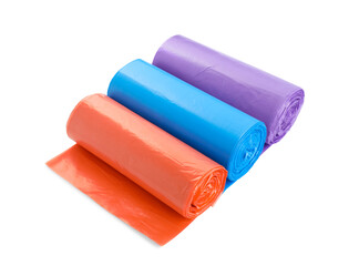 Rolls of different color garbage bags isolated on white