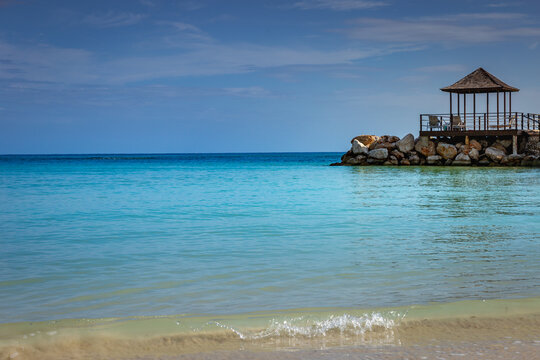 Tropical paradise: caribbean beach with pier and gazebo, Montego Bay, Jamaica © Aide