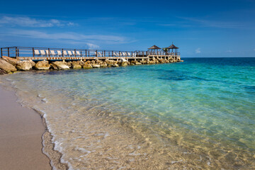 Fototapeta premium Tropical paradise: caribbean beach with pier and gazebo, Montego Bay, Jamaica