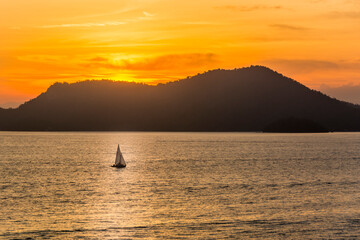 Sunset over the sea at the coast of Angra dos Reis town, State of Rio de Janeiro, Brazil. Photo...