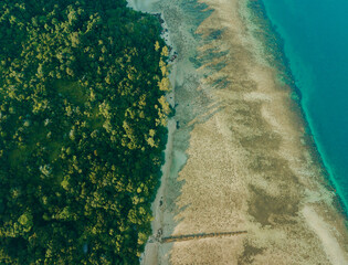 Fototapeta premium Aerial drone view of coastal scenery at Besar Island or Pulau Besar in Mersing, Johor, Malaysia