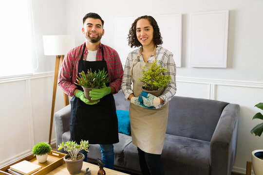 Portrait of an attractive couple feeling proud and happy with their gardening plants