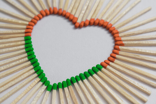 heart made of matches on white paper background. Indian tricolor concept.