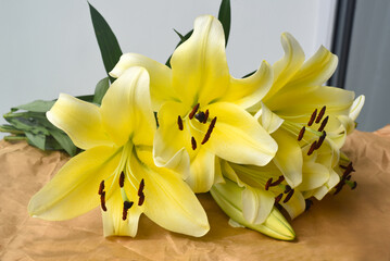 Yellow Lilly bouquet on craft paper