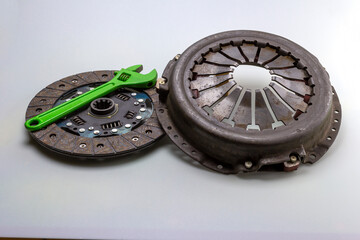 car parts - clutch basket and components of the transmission system of cars on a white milky background.