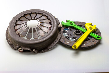 car parts - clutch basket and components of the transmission system of cars on a white milky background.