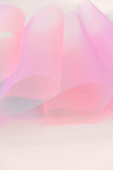 Wallpaper mauve phone.Tulle fabric.iridescent gradient texture.Shiny pink fabric with gradients....