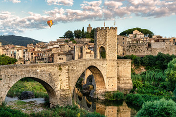 Balloon trip over the medieval village of Besalú en Girona, Catalonia, Spain. Foreground of...